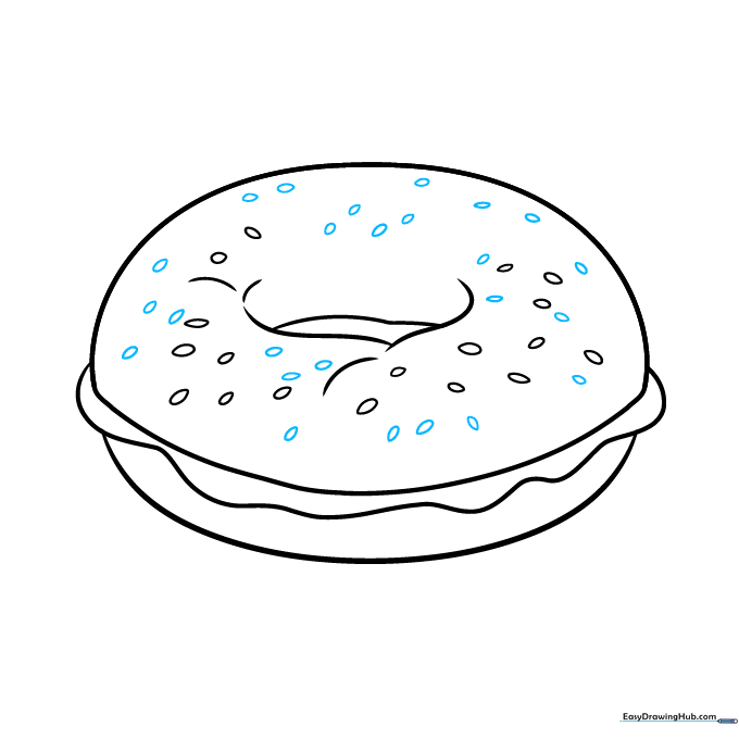 Adding additional sesame seeds to the bagel surface.