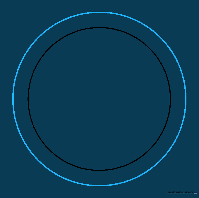 Two concentric circles drawn on paper, establishing the outer boundary of the mandala design.