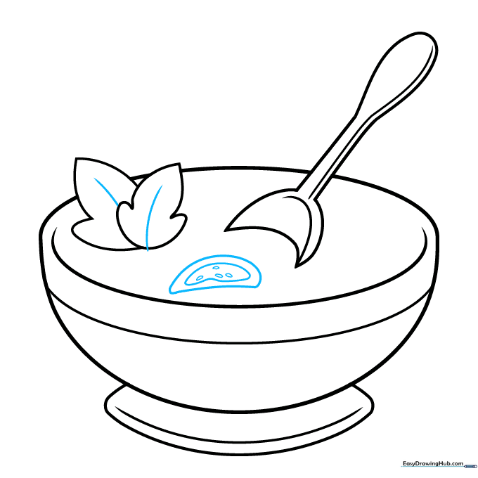 Adding a sliced tomato with visible seeds to the soup bowl.