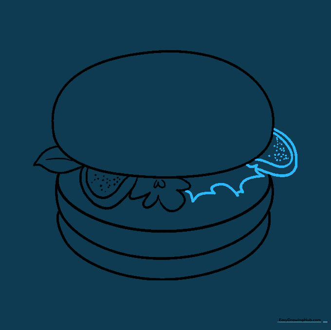 Adding extra layers of lettuce and tomato to the burger stack.