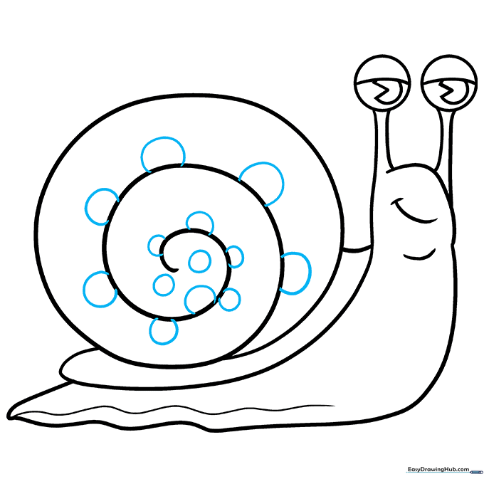 The snail shell decorated with small, varying-sized circular patterns.