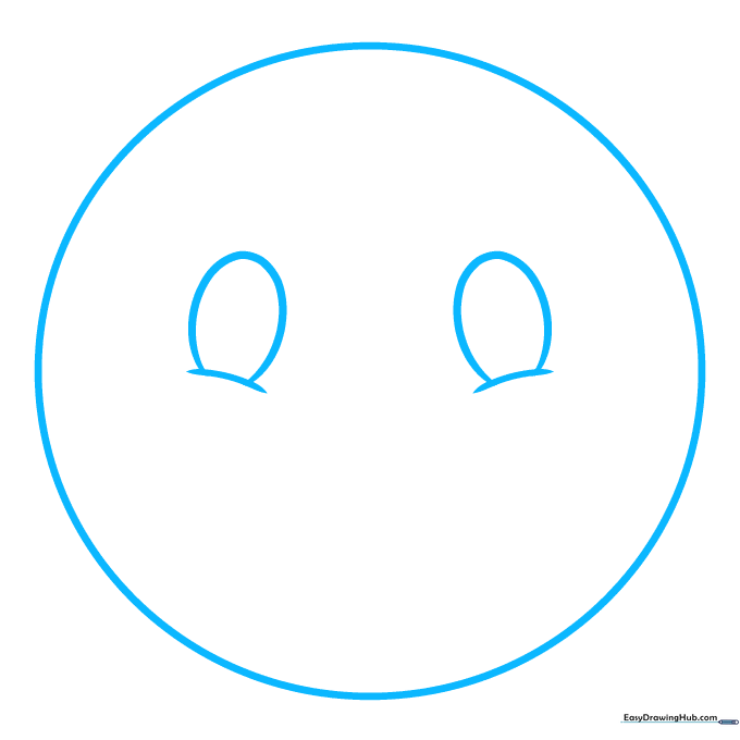 Pencil sketch showing a large circle with two eye ovals and two small cheek curves.