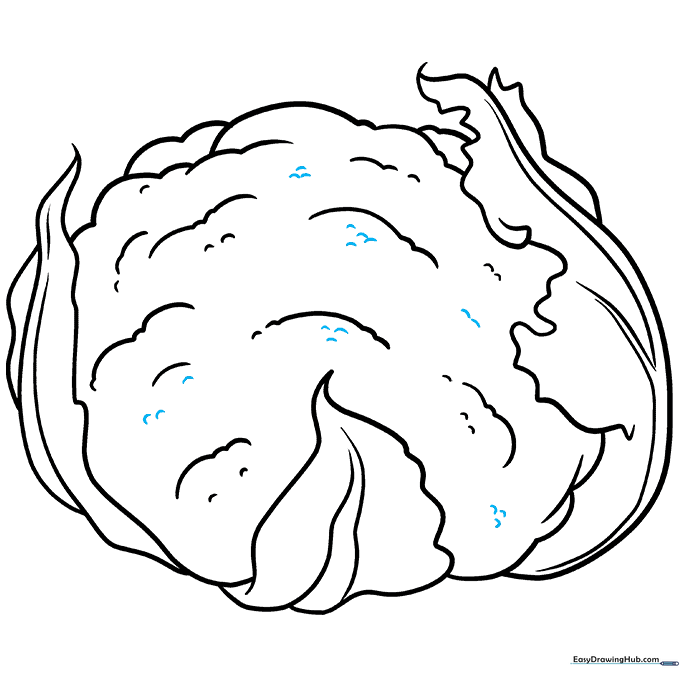 Adding final texture details to the cauliflower using small U-shaped marks.