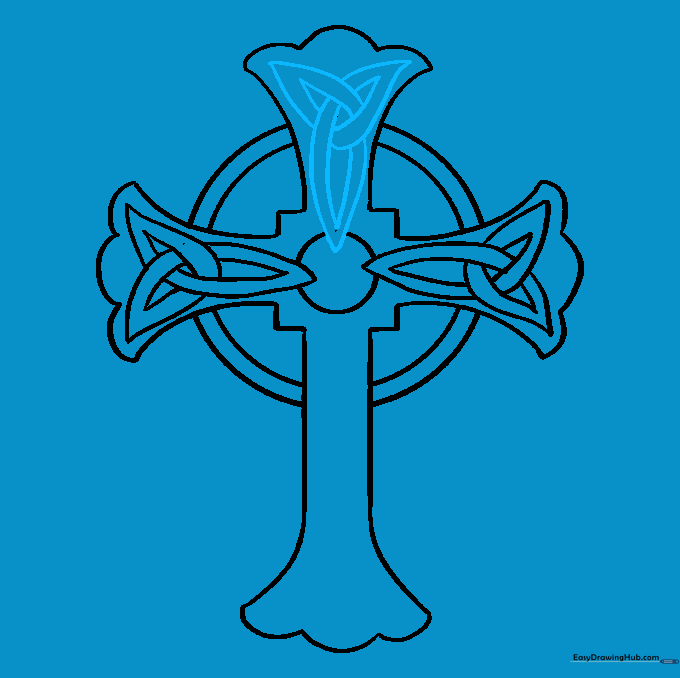 Adding teardrop knotwork details to the top arm of the cross.