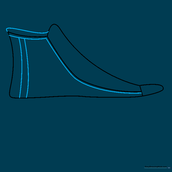 Detailing the inner lining and double stitching lines on the sneaker.