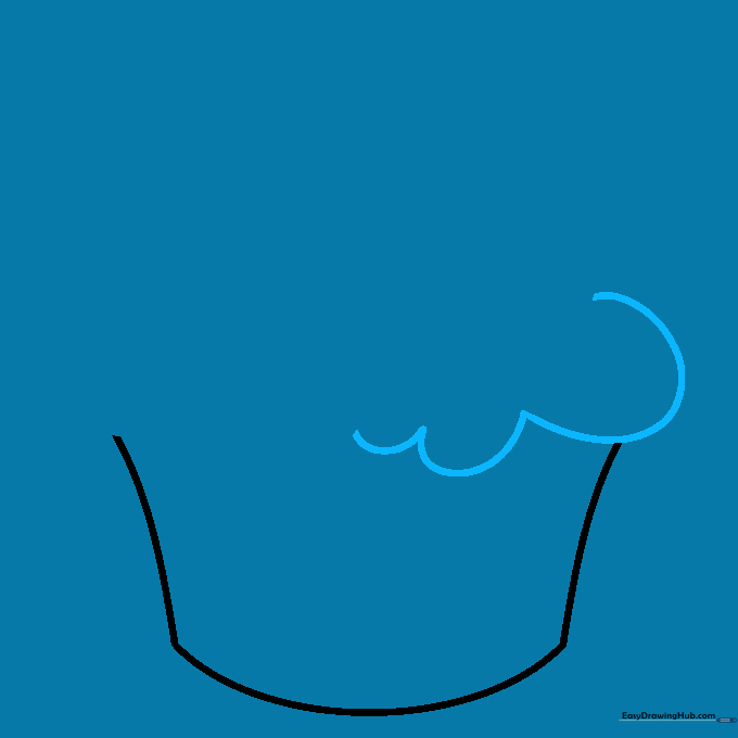 First layer of cupcake frosting drawn as a series of connected U-shaped curves sitting atop the liner.
