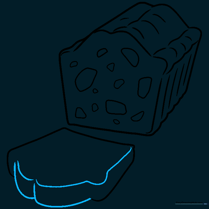 Adding W-shaped lines to the top of the fruitcake slice.