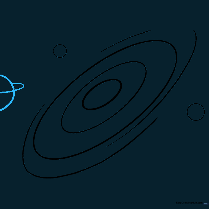 A half-circle planet with a ring structure drawn on the side of the paper.