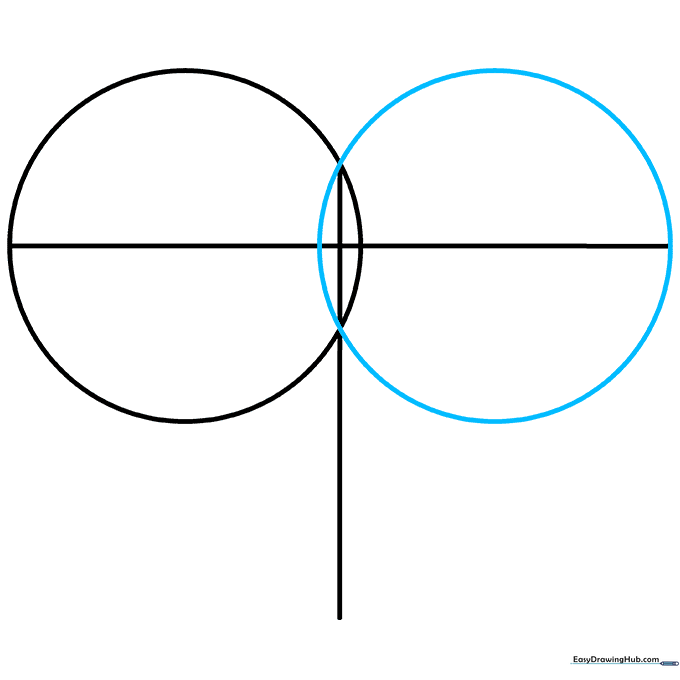 Two circles overlapping the T-guide to create the top rounded sections of the heart.