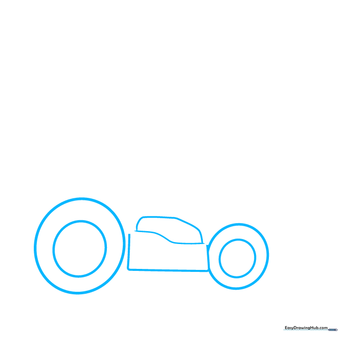 Pencil sketch showing two circles representing the front and back wheels of a Mario Kart.