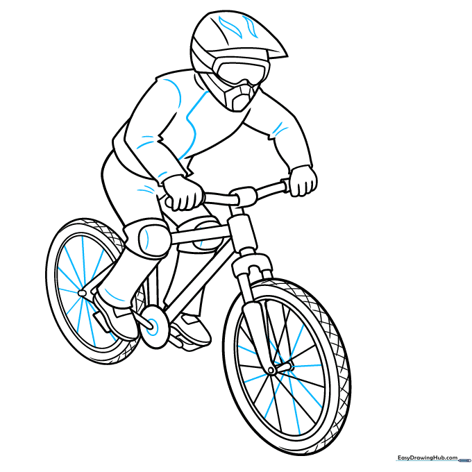 Step 9: Outlining the entire mountain biker drawing with ink to prepare for coloring.
