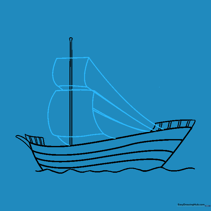 Two sails attached to the mast with rigging lines connecting to the deck.