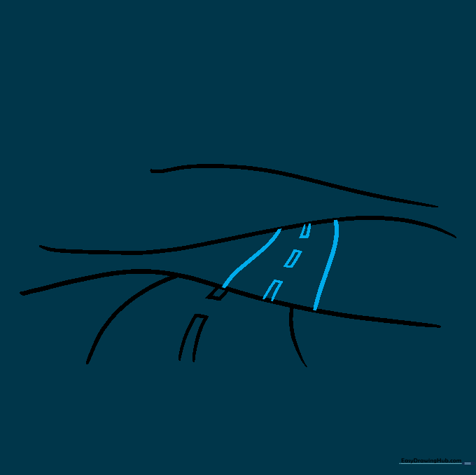 The road continuing over the second hill with clear lane markings.