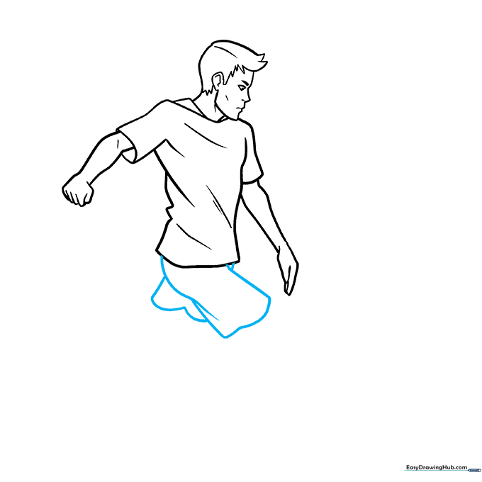 Outlining the soccer player's athletic shorts.