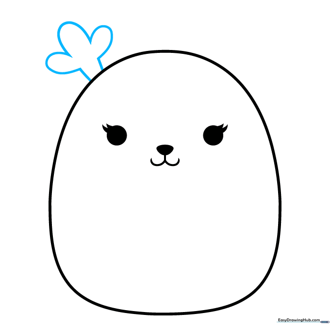 Drawing the first antler on the side of the Squishmallow head using curved lines.