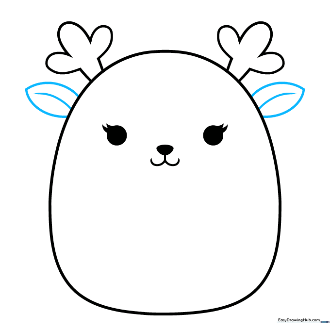 Adding pointed ears to the sides of the Squishmallow head below the antlers.