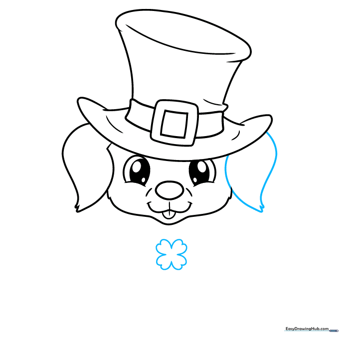 Adding a four-leaf clover under the puppy's chin and finishing the second ear.