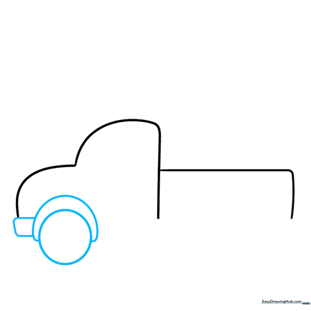 Drawing the front wheel well and bumper onto the truck chassis.