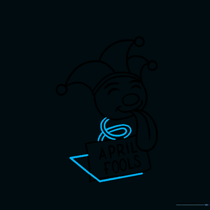 The jester head now attached to a spiral spring sitting inside an open box.