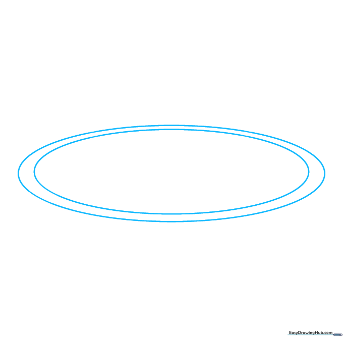 Two concentric ovals drawn on paper representing the first orbital path of an atom.