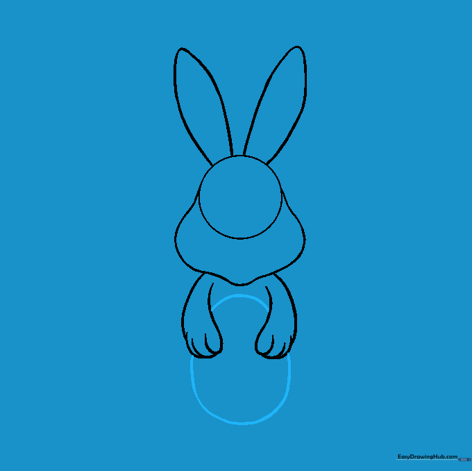 An oval Easter egg positioned between the bunny's paws.