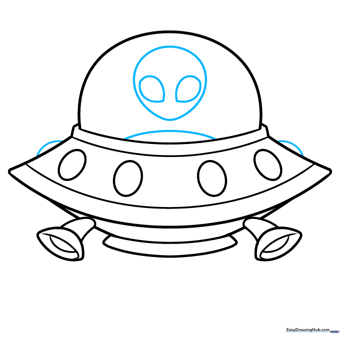 Sketching the alien pilot with lemon-shaped eyes inside the spaceship dome.