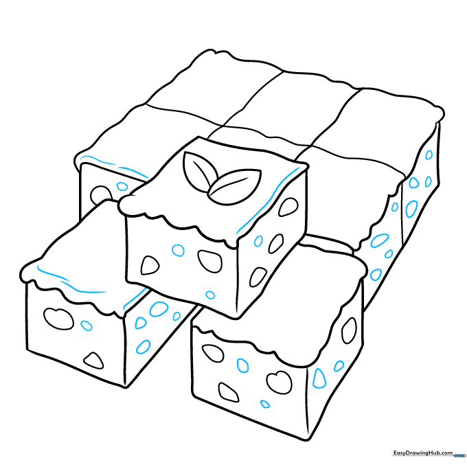 Adding final texture lines to the icing and brownie surface.