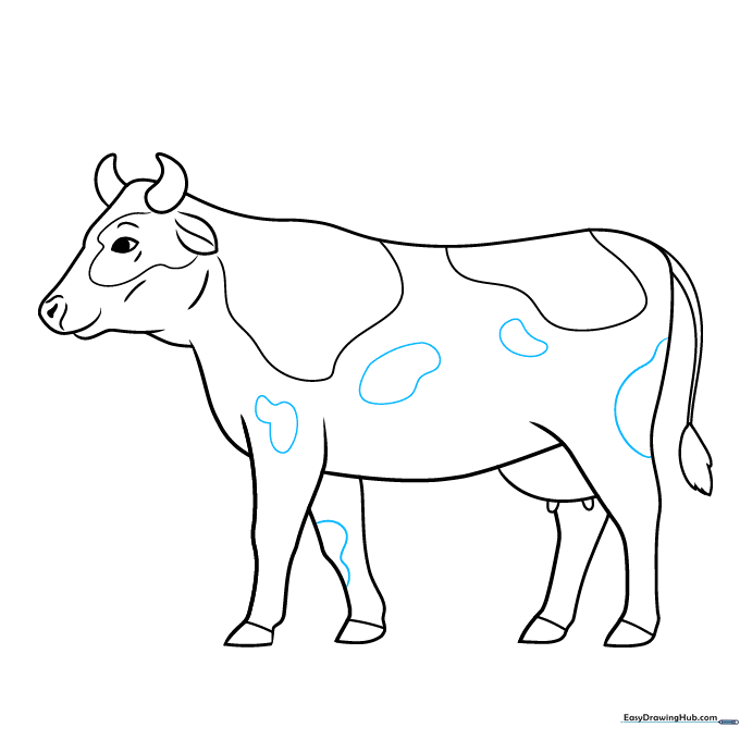 Finalizing the cow's spot pattern.