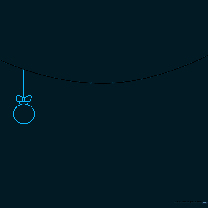A circular Christmas ornament hanging from a string with a decorative bow on top.