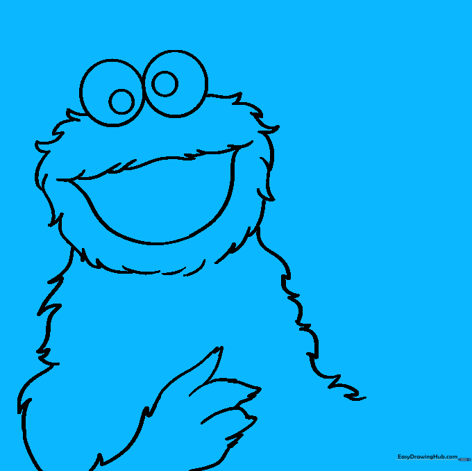 Cookie Monster holding a chocolate chip cookie between his fingers.