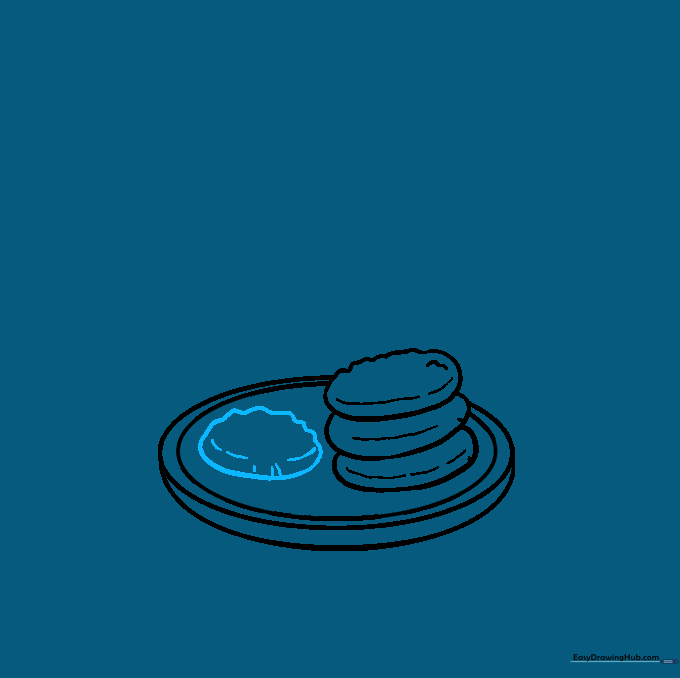 Adding an extra cookie to the side of the stack on the plate.