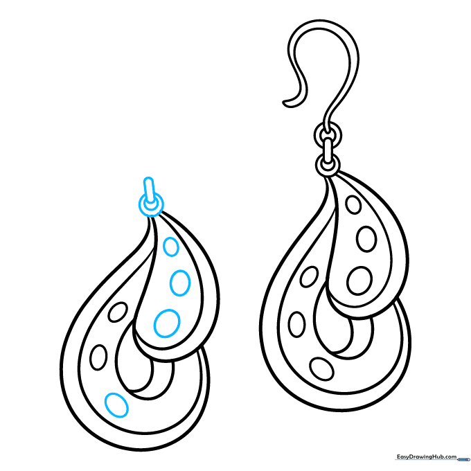 Finalizing the hardware details on the second earring to complete the pair.