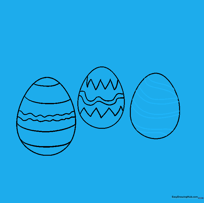 The third egg decorated with a combination of horizontal and diagonal striped bands.