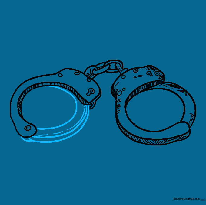 The second handcuff fully outlined with final shading applied.