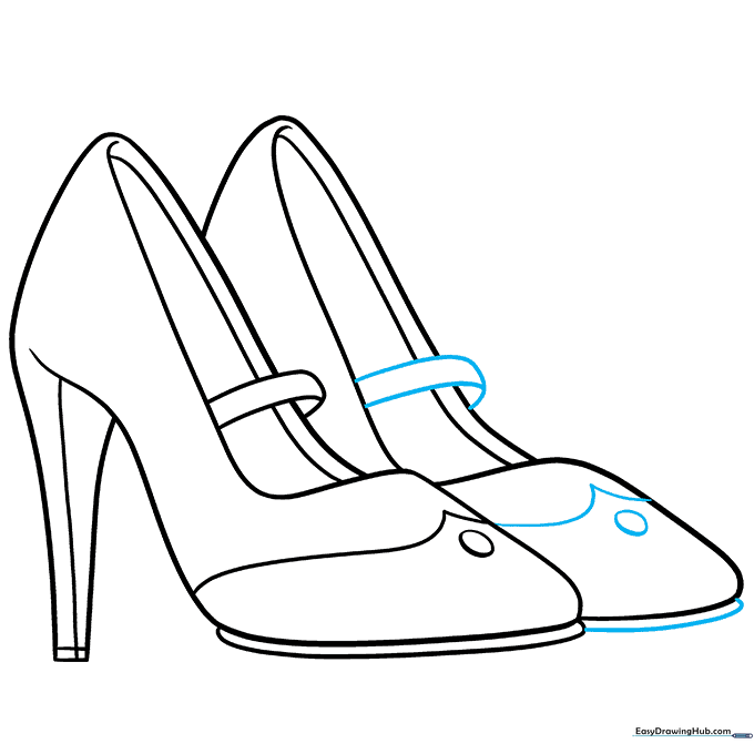 Finalizing the second shoe with straps and decorative details.