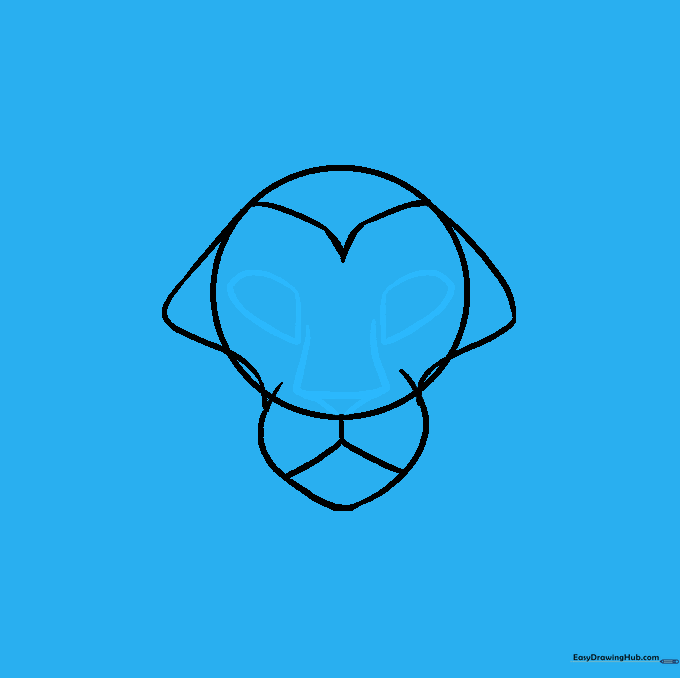 Adding the nose triangle and eye shapes to the lion's face.