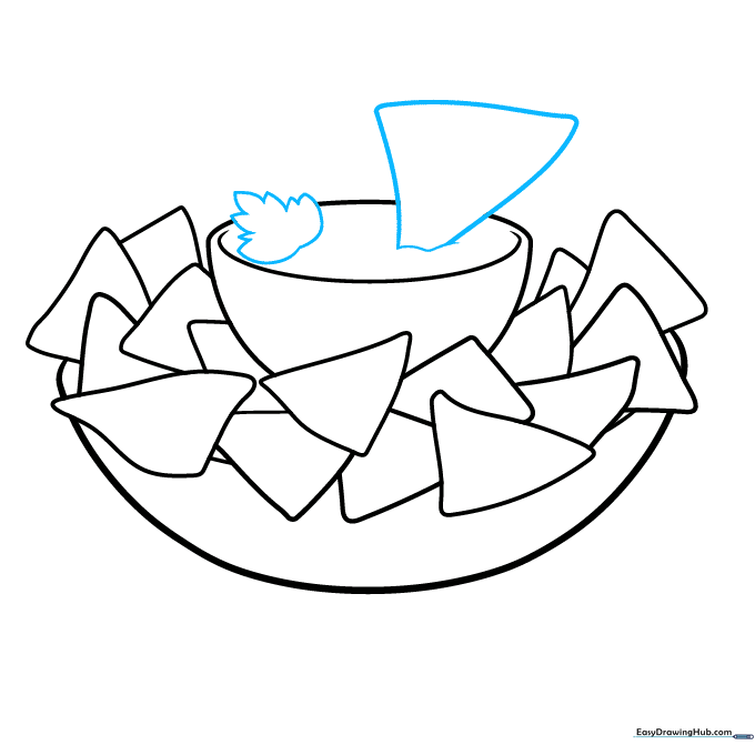 Adding a cilantro garnish and a chip dipping into the bowl.