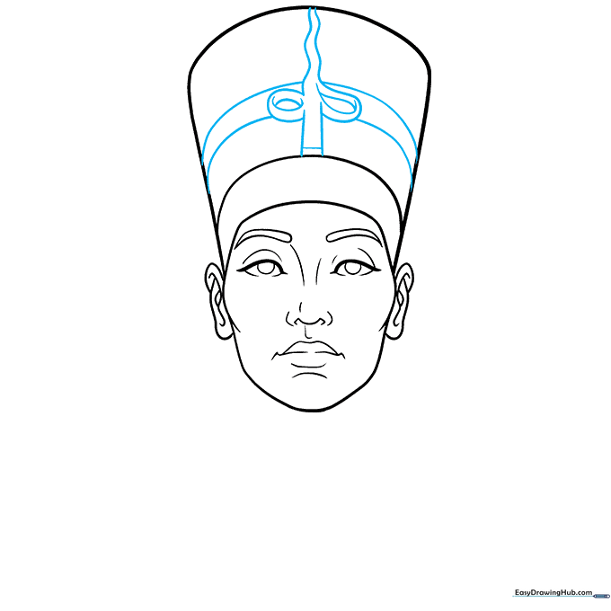Drawing the Uraeus cobra symbol on the front of the royal headdress.