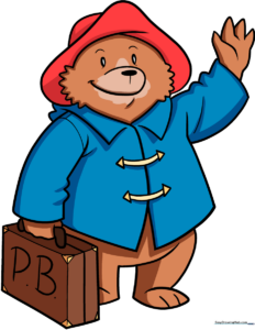 A completed, colorful illustration of Paddington Bear holding his suitcase.