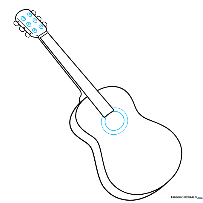 Guitar headstock with six tuning circles and a large sound hole on the body