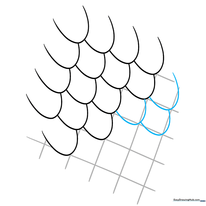 Completing the bottom rows of the scale pattern.