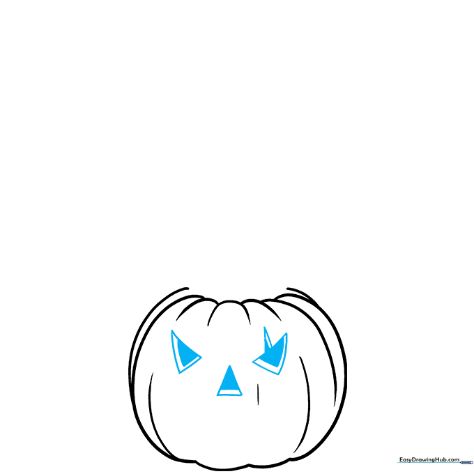 Drawing triangular eyes and a nose on the first pumpkin with shading to show depth.