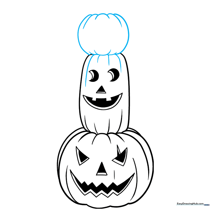 Adding the final, smallest pumpkin to the top of the stack.