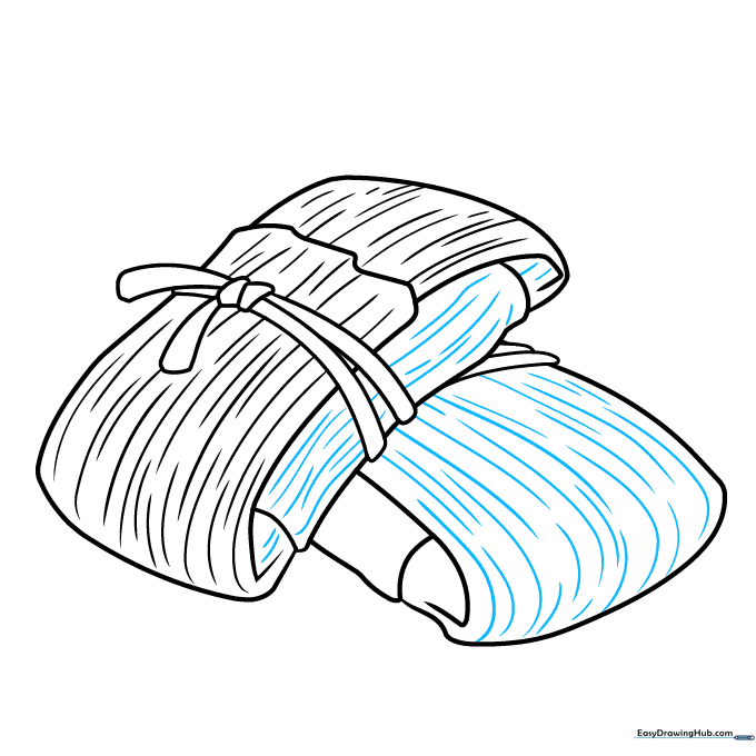Adding fine-tuned texture lines to the sides and tops of the tamales.