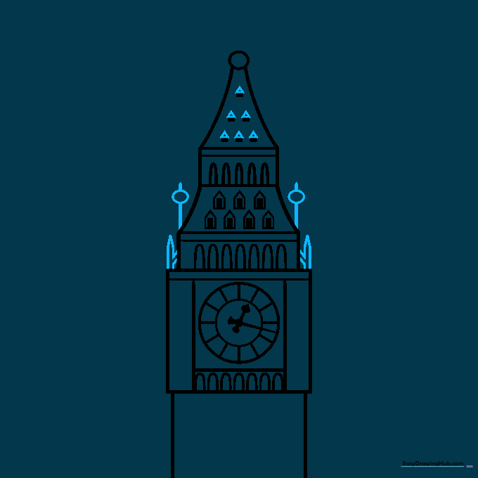 Adding the pointed spires and oval decorative elements to the tower top.