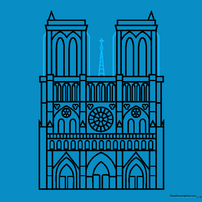 Adding the final cross and spire details to the cathedral towers.