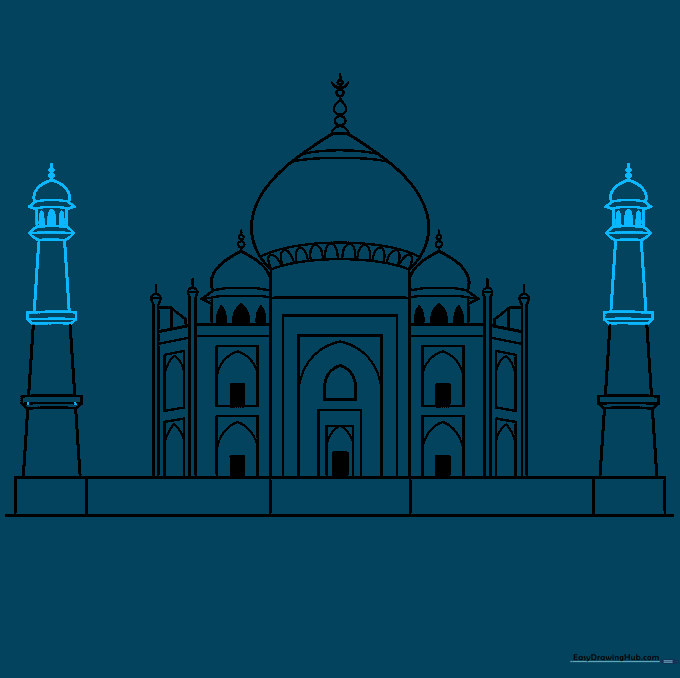 Detailed view of the upper levels and finials of the Taj Mahal towers.