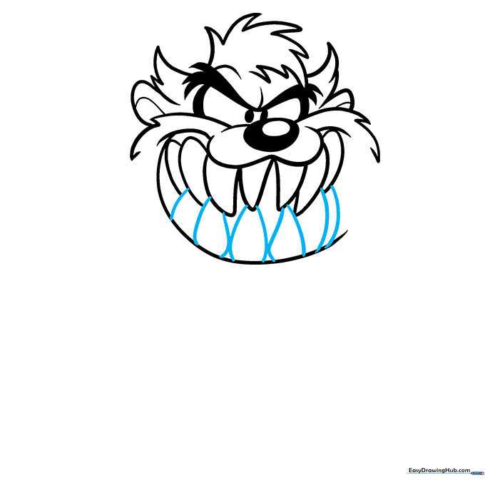 Detailed view of the lower teeth being added to the Tasmanian Devil's mouth.