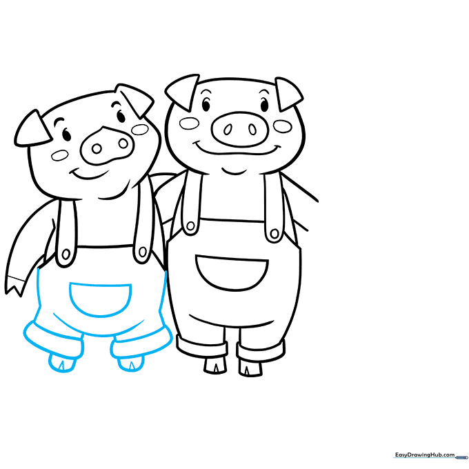 Adding the final details to the second pig's overalls.