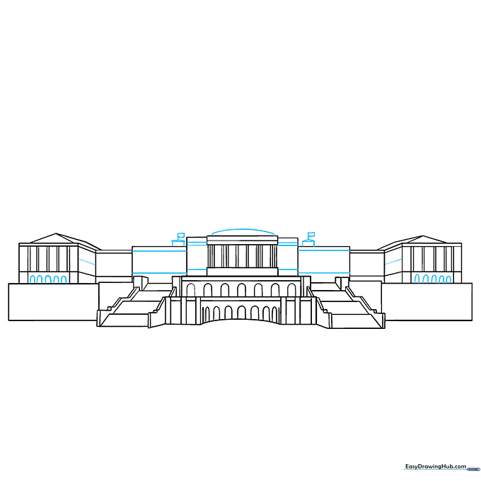 Adding flagpoles and flag details to the top of the building.